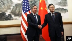 U.S. Secretary of State Antony Blinken shakes hands with Chinese Foreign Minister Qin Gang at the Diaoyutai State Guesthouse in Beijing, China, June 18, 2023. 