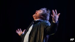 FILE - Presidential candidate of the Liberty Advances coalition Javier Milei greets supporters during a campaign rally in Buenos Aires, Argentina, Oct. 18, 2023.