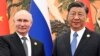 Presiden Rusia Vladimir Putin (kiri) dan Presiden China Xi Jinping berbicara melalui telepon Kamis (8/2).