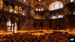 FILE - Muslim worshippers pray during the Muslim holy fasting month of Ramadan at Hagia Sophia mosque in Istanbul, Turkey, April 14, 2023. 