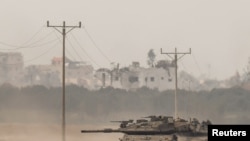 2024年1月11日，以色列南部以色列-加沙边境附近，以色列坦克从加沙重新进入以色列。 