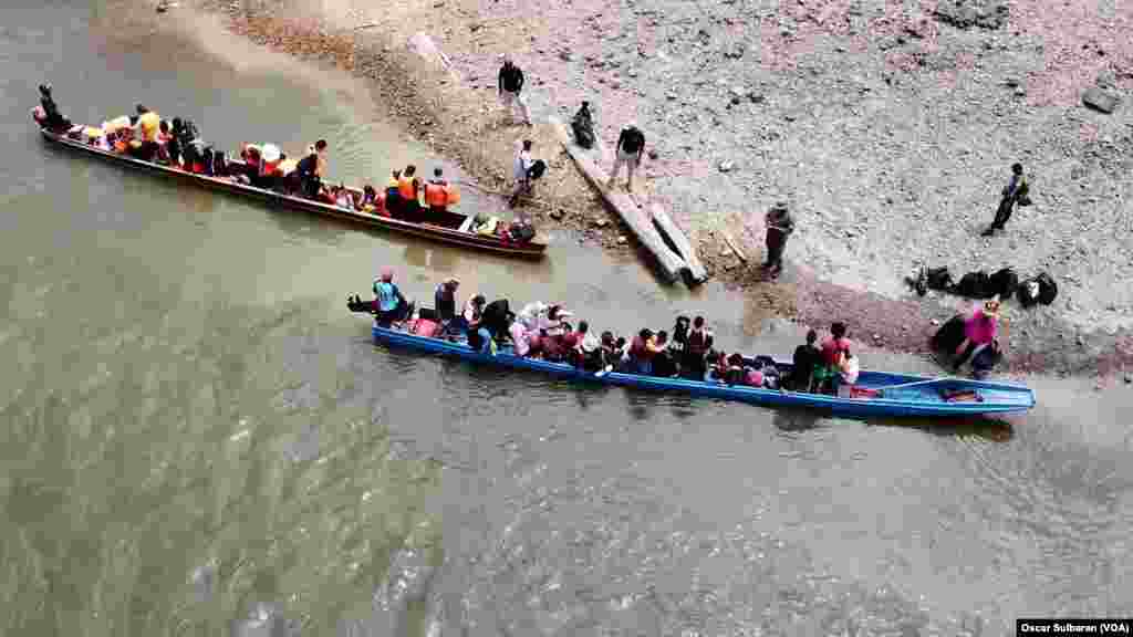 Migrants are about to leave boats from the Darien jungle to the shore of the Chucunaque River in in Lajas Blancas, Darien Province, Panama, on Feb. 24, 2024. The boat trip costs $25.