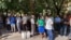 A large crowd of Uzbek journalists and activists wait outside Mirabad Disctrict Criminal Court in Tashkent, Uzbekistan, to observe the trial of blogger Abduqodir Muminov, July 25, 2023. (Farukh Samarqandiy/VOA Trainee) 