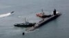 ILUSTRASI - Kapal selam bertenaga nuklir USS Michigan mendekati pangkalan angkatan laut di Busan, Korea Selatan, Jumat 16 Juni 2023. (Gang Duck-chul/Yonhap via AP)
