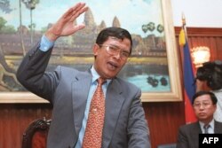 FILES - Cambodia's Second Prime Minister gestures during a press conference, issuing a stern warning to ASEAN against interfering in Cambodia's internal affairs, in Phnom Penh on July 10, 1997. (Photo by Emmanuel DUNAND / AFP)