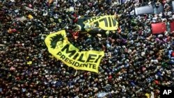 Javier Milei supporters gather outside his campaign headquarters after his opponent, Economy Minister Sergio Massa, conceded defeat in the presidential runoff election, in Buenos Aires, Argentina, Nov. 19, 2023.