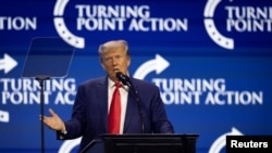 Former U.S. President and Republican presidential candidate Donald Trump gestures as he speaks during the Turning Point Action Conference in West Palm Beach, Florida, U.S. July 15, 2023.