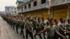 FILE - This photo taken on April 17, 2019, shows United Wa State Army (UWSA) soldiers walking during a ceremony in Panghsang to commemorate 30 years of a ceasefire signed with the Myanmar military in the Wa State.