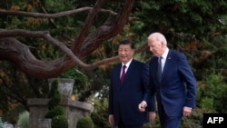China's president Xi Jinping, left, talks with U.S. President Joe Biden after meeting in Woodside, California, on Nov. 15, 2023. 
