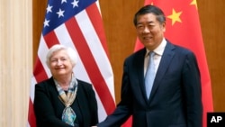 FILE - Treasury Secretary Janet Yellen shakes hands with Chinese Vice Premier He Lifeng during a meeting at the Diaoyutai State Guesthouse in Beijing, July 8, 2023. Yellen is hosting He for two days of talks this week. 