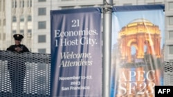 Police stand on a bridge at the Moscone convention center hosting the Asia-Pacific Economic Cooperation (APEC) leaders' week in San Francisco, California, on Nov. 13, 2023. 