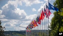 Flags of NATO member countries flap outside the venue of the NATO summit in Vilnius, Lithuania, July 9, 2023. Russia's war on Ukraine will top the agenda when U.S. President Joe Biden and his NATO counterparts meet in Vilnius on Tuesday and Wednesday.