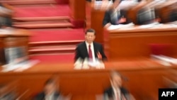 中国领导人习近平在北京人大会堂出席全国人大会议开幕式。(2024年3月4日)