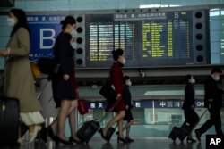 Penerbangan internasional di Beijing Capital International Airport di Beijing, Rabu, 26 April 2023. (Foto: AP)