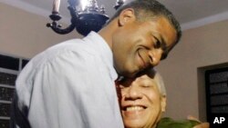 FILE - Cuba's Oscar Elias Biscet, left, embraces fellow dissident Angel Polanco after being released from jail in Havana, March 11, 2011. Biscet was briefly detained January 9, 2024, in Havana, according to a statement from the U.S. Agency for Global Media. 