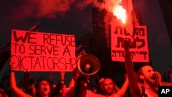 Israelis protest against plans by Prime Minister Benjamin Netanyahu's government to overhaul the judicial system in Tel Aviv, Israel, July 29, 2023.