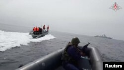 Participants sail boats during a joint Russian-Chinese naval exercise in the waters of the Sea of Japan, in this still image taken from video released by the Russian Defense Ministry July 20, 2023.