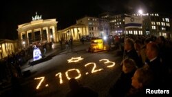 FILE - People commemorate the victims of the October 7 Hamas attack on Israel, in front of Brandenburg gate, in Berlin, Germany, Nov. 7, 2023. Several nations, including Germany and the U.S., have established a task force to counter the flow of money to Hamas.