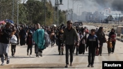 Palestinians flee Khan Younis amid the ongoing conflict between Israel and the Palestinian Islamist group Hamas, move towards Rafah, in the southern Gaza Strip, Jan. 25, 2024.