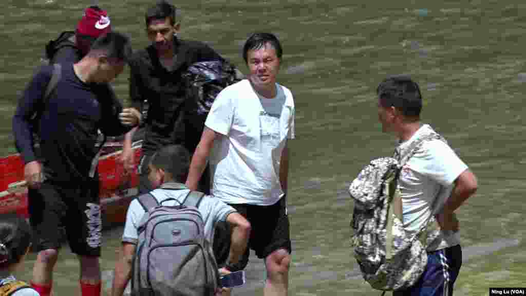 Chinese migrants leave boats that brought them to Lajas Blancas, Darien Province, Panama, on Feb. 23, 2024.
