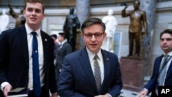 FILE — U.S. House Speaker Mike Johnson walks on Capitol Hill in Washington, Jan. 18, 2024. In a letter to members, Johnson said legislation providing $17.6 billion in new military assistance to Israel in its war against Hamas could come to a vote in the full House next week.