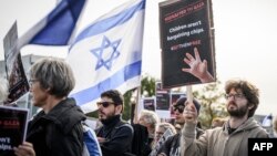 Supporters of Israel, members of the Jewish community and hostages' families and friend attend a rally calling for the release of hostages held by Hamas, near the United Nations' European headquarters in Geneva, Oct. 22, 2023.
