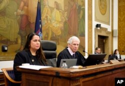 Judge Arthur Engoron, right, and principal law clerk Allison Greenfield sit on the bench during former President Donald Trump's civil business fraud trial at New York Supreme Court, Oct. 17, 2023, in New York.