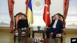 In this handout photo released by Turkish Presidency, Turkey's President Recep Tayyip Erdogan, right, sits next to Ukraine's President Volodymyr Zelenskyy during their meeting at Dolmabahce palace in Istanbul, Turkey, March 8, 2024.