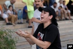 A woman reacts to the news of the death of Hezbollah leader Hassan Nasrallah in Beirut on Sept. 28, 2024.
