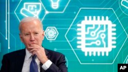 FILE - President Joe Biden attends an event to support legislation that would encourage domestic manufacturing and strengthen supply chains for computer chips in the South Court Auditorium on the White House campus, in Washington, March 9, 2022