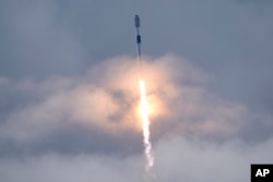 FILE - A SpaceX Falcon 9 rocket, with a payload of Starlink satellites for a high-speed low earth orbit internet constellation, lifts off from launch complex 40 at Cape Canaveral Space Force Station in Cape Canaveral, Florida, July 17, 2022.