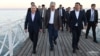 Uzbek, Kazakh and Kyrgyz leaders, Shavkat Mirziyoyev, from left, Kassym-Jomart Tokayev and Sadyr Japarov take a walk by the Issyk-Kul Lake, Cholpon-Ata, Kyrgyzstan, July 20, 2022. 