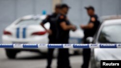 Policajci na mestu napada na Cetinju, 12. avgust 2022 (Foto: REUTERS/Stevo Vasiljevic)
