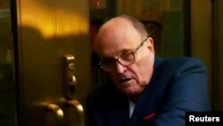 FILE - Rudy Giuliani arrives to face a special grand jury regarding a probe into the 2020 election, in Atlanta, Aug. 17, 2022, in this image from video. A judge said July 10, 2024, that he would likely end bankruptcy for Giuliani, which would let lawsuits against him proceed.