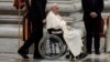 Pope Francis sits in a wheelchair as he leaves after presiding over a vigil, ahead of the Synod of bishops, at Saint Peter's church at the Vatican, Oct. 1, 2024. 