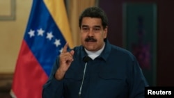 Fallen electric pylons block a road in Surigao City, Surigao del norte province, days after super Typhoon Rai devastated the city.