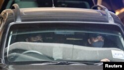 A car carrying former Malaysian Prime Minister Najib Razak leaves the Federal Court, in Putrajaya, Malaysia, Aug. 23, 2022.