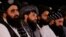 FILE - Afghan Taliban's acting Minister of Defense Mullah Mohammad Yaqoob, center, attends the first anniversary ceremony of the Taliban's takeover of Kabul, Aug. 15, 2022. As the Taliban struggles to gain international recognition, are signs of increasing internal dissent.