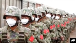 资料照片：这张取自俄罗斯国防部新闻处视频的照片显示，中国士兵在俄罗斯滨海边疆区格罗杰科沃参加兵棋演习。（2022年8月29日）