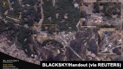 A satellite image collected over Ivankiv shows a Russian military convoy passing through scorched countryside, northwest of Kyiv, Ukraine, Feb. 28, 2022.