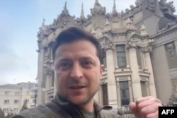 President of Ukraine Volodymyr Zelenskyy shows himself speaking to a camera in Ukraine after a Russian attack, and vowing to stay and fight on, Feb. 26, 2022, in this screen grab taken from a video made available on his Facebook account.