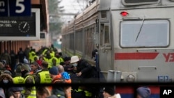 Displaced persons fleeing from Ukraine crowd a platform at the train station in Przemysl, Poland, March 3, 2022.