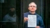 FILE - Paul Whelan, a former U.S. Marine who was arrested for alleged spying, listens to the verdict in a courtroom at the Moscow City Court, in Moscow, Russia, June 15, 2020. (Moscow News Agency photo via AP)