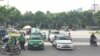 Grab competes with traditional taxis in Vietnam. (H. Nguyen/VOA)