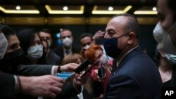 Turkish Foreign Minister Mevlut Cavusoglu speaks to the media in Ankara, Turkey, March 9, 2022, a day before a trilateral meeting in Turkey between Cavusoglu, Ukraine's Foreign Minister Dmytro Kuleba and Russia's Foreign Minister Sergey Lavrov.
