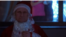 A screenshot from a Russian propaganda ad featuring Russia's President Vladimir Putin as Santa. (Telegram)