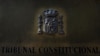 FILE - A plaque is seen at the entrance of Spain's Constitutional Court building in Madrid, Spain, Sept. 6, 2017. A Spanish a court handed down a two-year prison sentence to a journalist accused of revealing details from a judicial investigation.