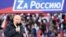 Russian President Vladimir Putin delivers a speech during a rally at Luzhniki Stadium in Moscow, March 18, 2022. The banner reads: "For Russia," using the untraditional "Z" representative of Russia's campaign in Ukraine. (Sputnik/Kremlin via Reuters)