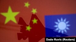 Chinese and Taiwanese national flags are displayed alongside a military airplane in this illustration taken April 9, 2021. (Reuters/Dado Ruvic)