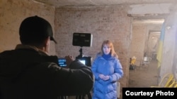 FILE - Editor Natalya Lutsenko, ICTV, during a during a live segment broadcast from a bomb shelter in Kyiv, Ukraine, Feb. 25, 2022. (Photo courtesy: Natalya Lutsenko) 